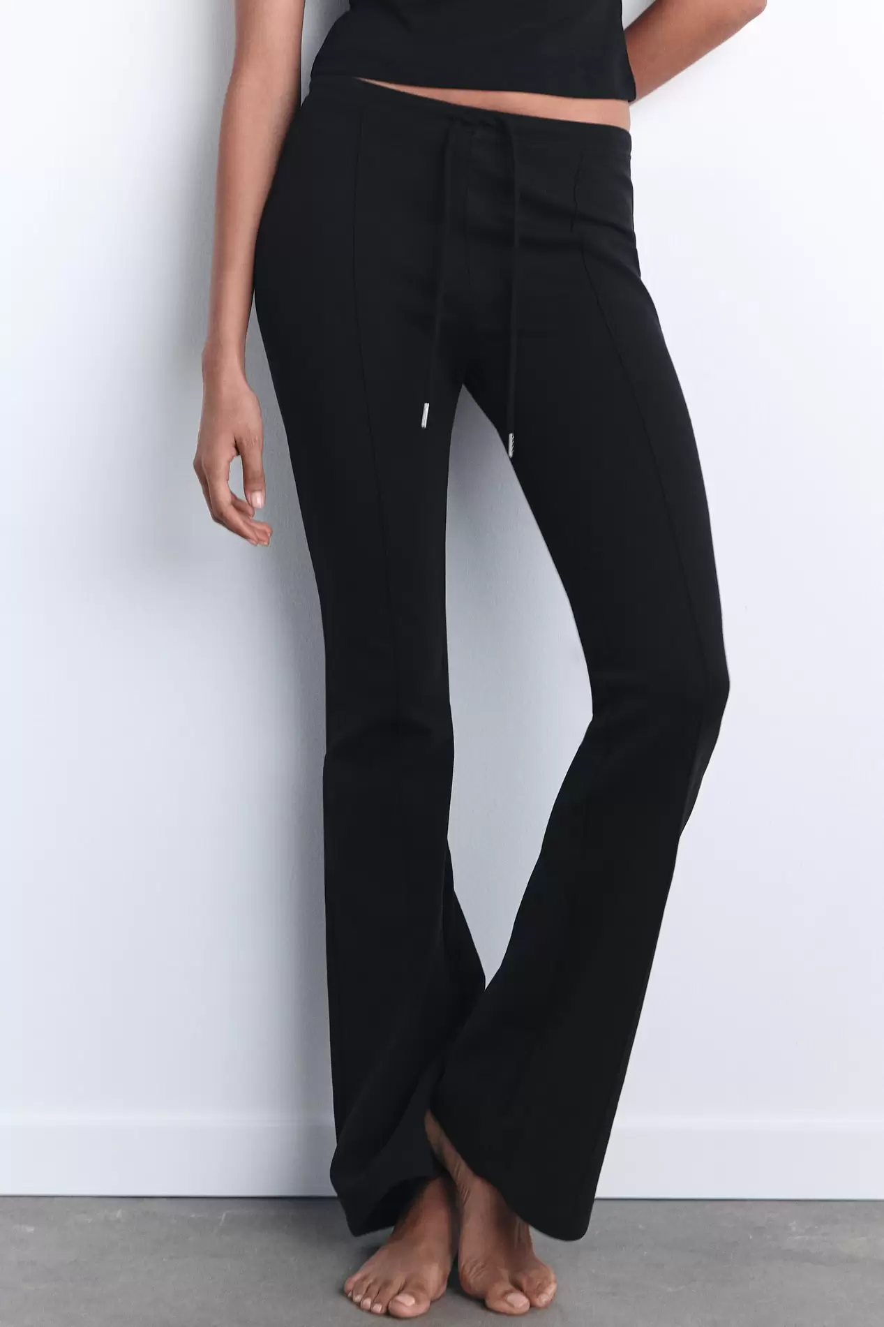 INTERLOCK STITCH BELL BOTTOM TROUSERS offers at S$ 59.9 in ZARA