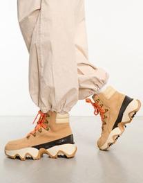 Sorel Kinetic Impact Conquest waterproof lace up boots in camel offers at S$ 146.89 in asos