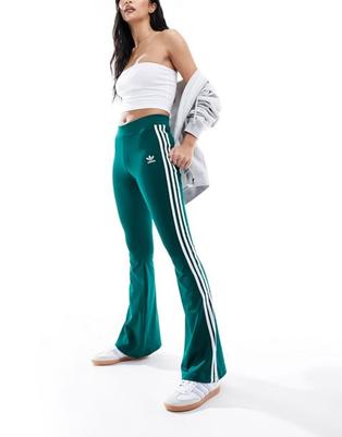 Adidas Originals three stripe flared leggings in collegiate green offers at S$ 50 in asos