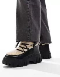 South Beach Faux Fur Chunk Lace Up Boot in Black and Beige offers at S$ 60 in asos