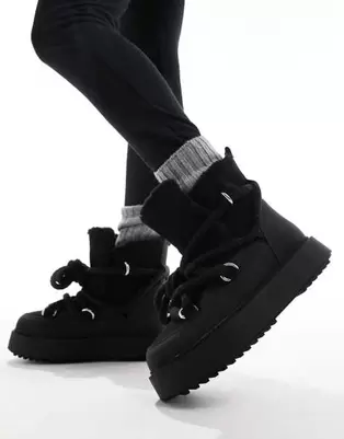 ASOS DESIGN Alpine shearling lace up snow boots in black offers at S$ 45 in asos