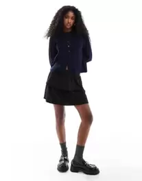 Pimkie ruffle mini skirt in black offers at S$ 26 in asos