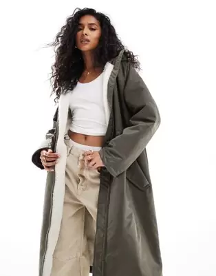 ASOS DESIGN borg lined longline rain coat in khaki offers at S$ 107.99 in asos