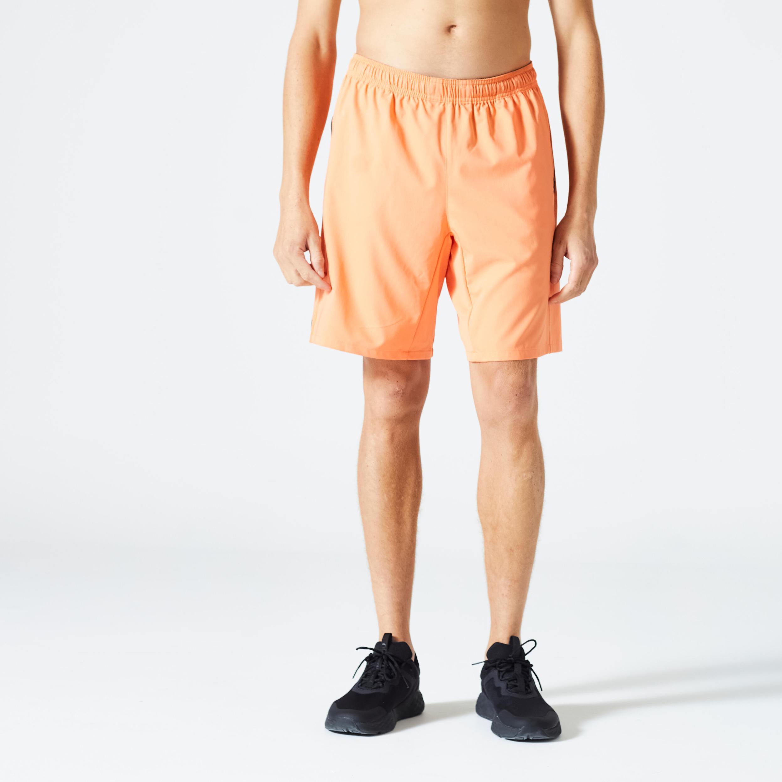 Men's Fitness Shorts With Zipper Pockets - Orange offers at S$ 10.9 in Decathlon