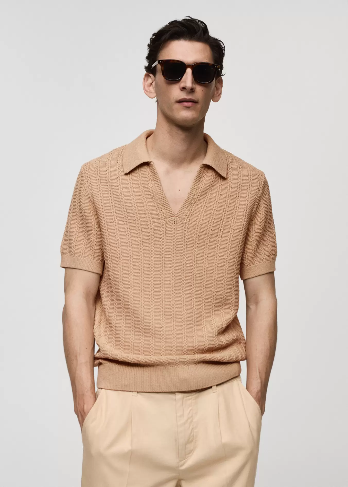 Twisted knitted cotton polo shirt offers at S$ 45.9 in HE by Mango