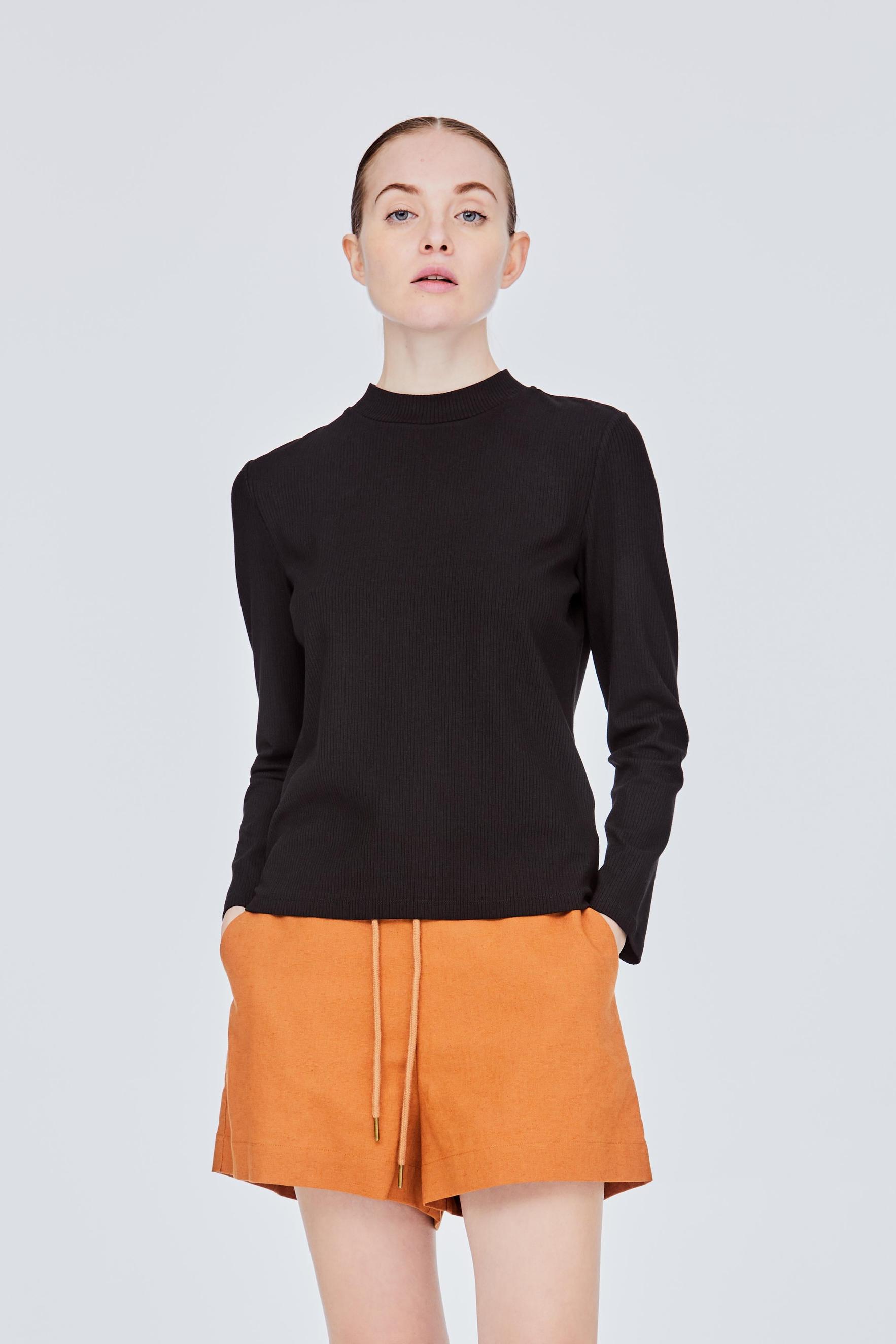Crew High Neck Fit Ribbed Top offers at S$ 19.9 in Iora