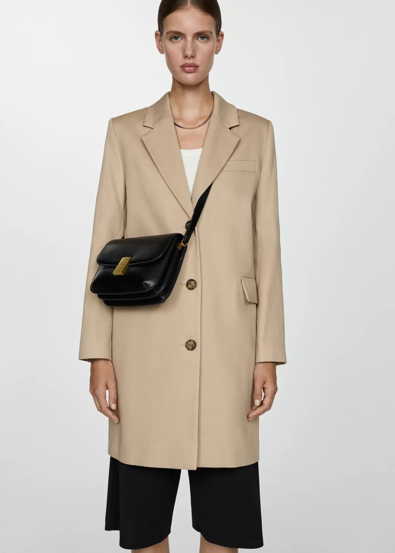 Straight cotton midi coat offers at S$ 75.9 in Mango