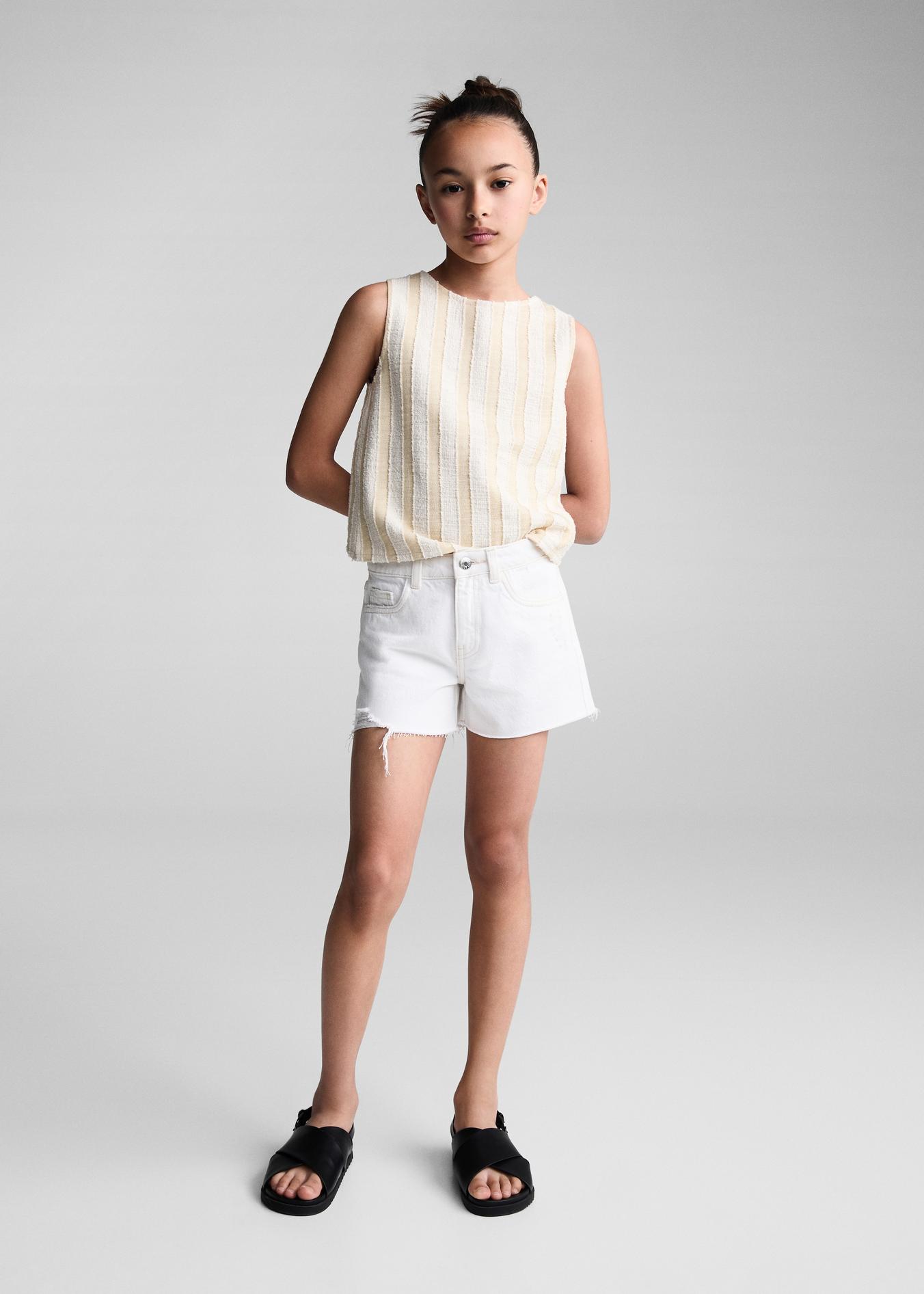 Decorative ripped denim shorts offers at S$ 19.9 in Mango Kids