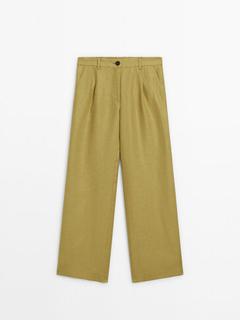 Wide-leg linen trousers offers at S$ 159 in Massimo Dutti