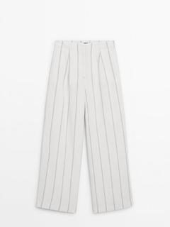 Wide-leg striped trousers offers at S$ 199 in Massimo Dutti
