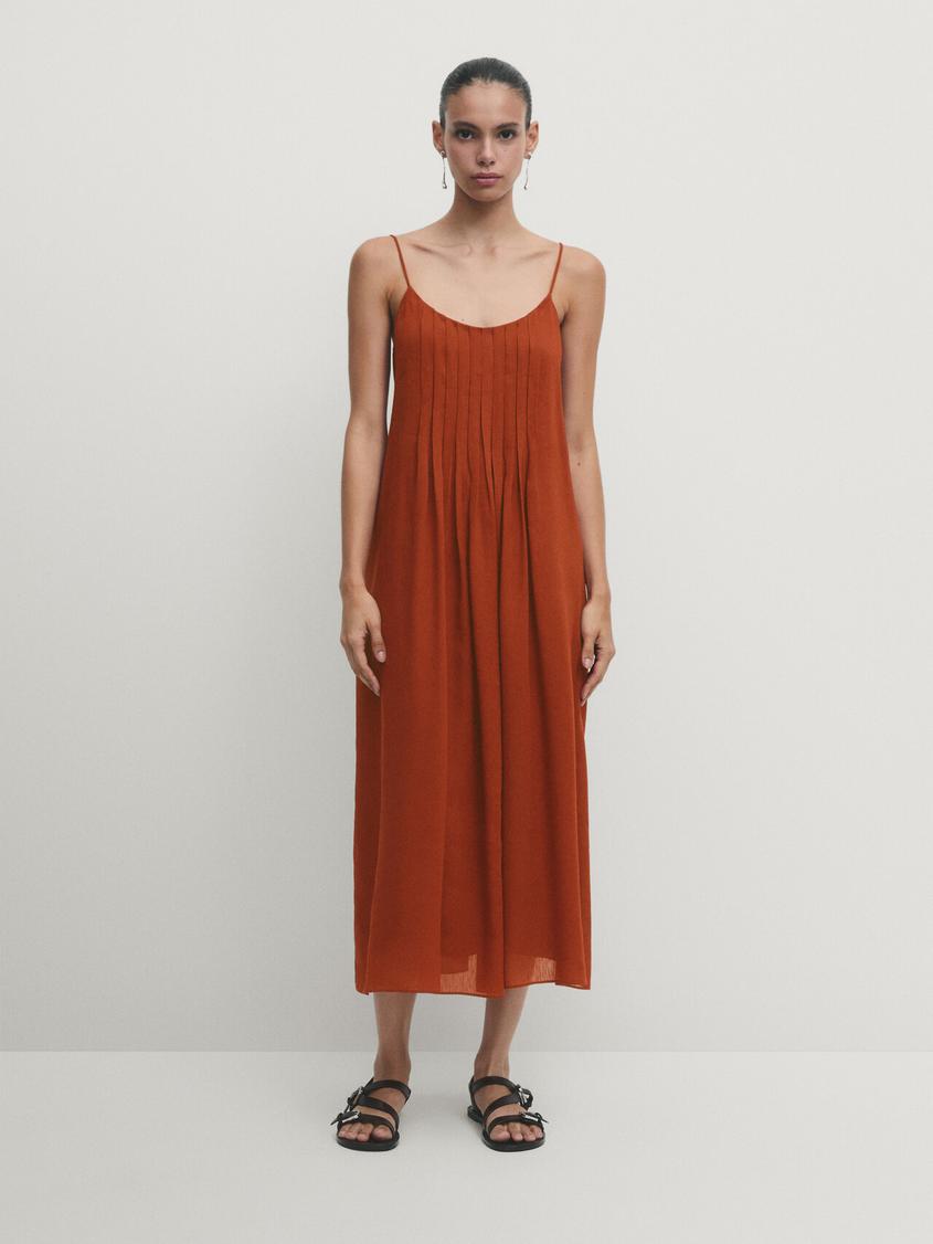 Strappy midi dress with box pleat details offers at S$ 245 in Massimo Dutti